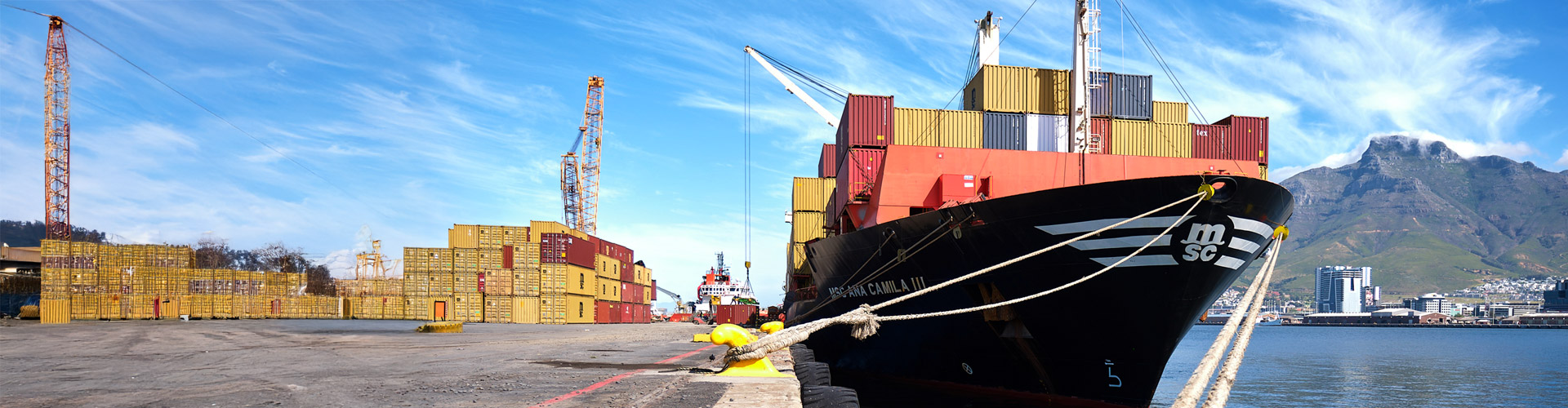 cargo ship with containers in the background